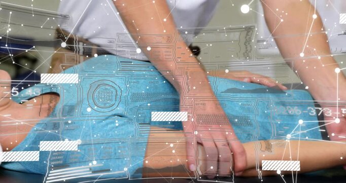 Physio therapist adjusting towel under neck, sliding hands down arm, boosting mobility in clinic