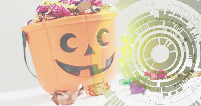 HUD overlay fading in beside pumpkin bucket, rotating and lighting segments to highlight candy