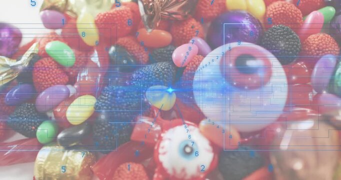 blue overlay starting scanning across candies highlighting wrappers then focusing eyeball gummy