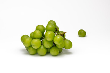 Close up of fresh green grapes with water drop on a white background