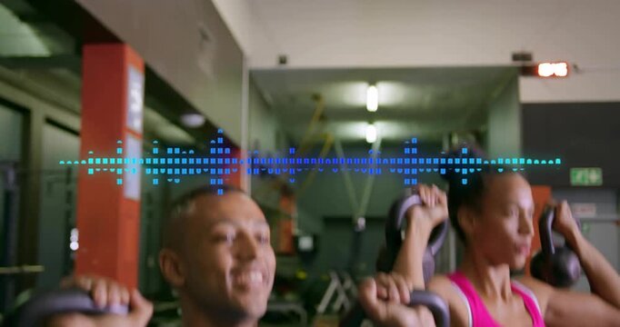 Fitness duo pressing kettlebells upward in sync in gym using waveform overlay for muscle gains