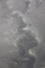 Cloudy sky with dark storm clouds. Natural weather background with thunderstorm stormy sky. Abstract background design.