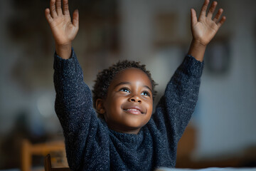 African American boy raising hands, distance learnin