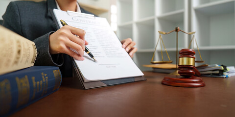 Lawyer Signing Important Legal Agreement in Office