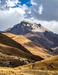 Mountain range with golden hills