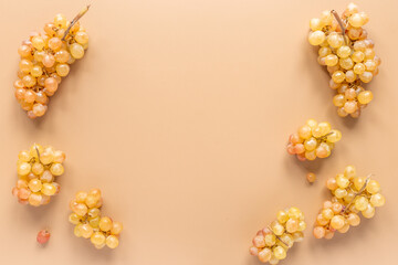 Many bunches of ripe yellow grapes, top view