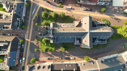 Arendonk, Antwerp, Belgium, August 6th, 2024, This breathtaking aerial view beautifully showcases the intricate urban streets and a very unique building design