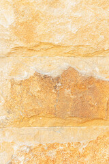 Beautiful stone wall laying in light sand color. natural stone texture. A sample of building material for walls. A copy of the space. layout.