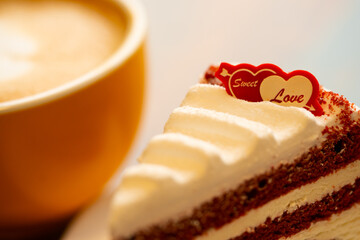 Homemade cake Red Velvet decorated with cream and cup of coffee