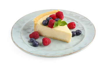 Piece of delicious cheesecake with fresh berries and mint isolated on white