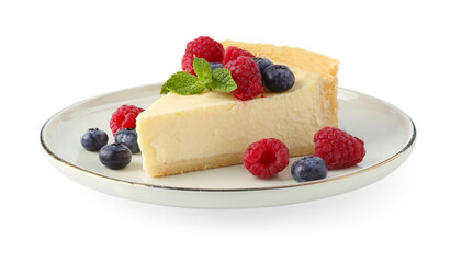 Piece of delicious cheesecake with fresh berries and mint isolated on white