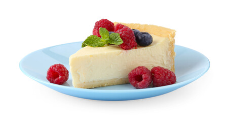 Piece of delicious cheesecake with fresh berries and mint isolated on white