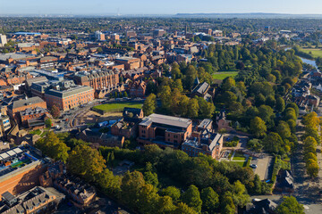 Aerial view of Chester cityscape with Grosvenor Park and the River Dee in the distance.