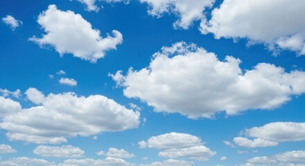 A vast expanse of a vibrant blue sky dotted with fluffy white clouds