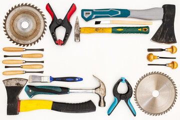 Flat lay of new and used hand tools on white background. Large collection of various tools and bits arranged on white.
