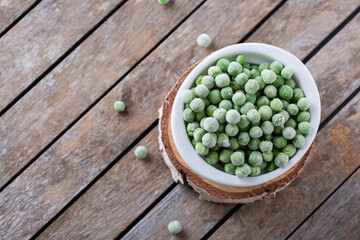 Frozen green peas in a bowl