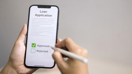 Loan application approved on smartphone, digital lending and mobile credit approval