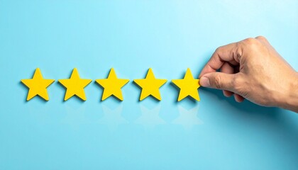 Six yellow stars on blue background with hand placing final star.