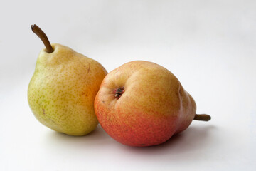 Two ripe pears isolated on white background, fresh organic fruit