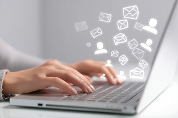 Obraz premium Close-up of hands typing on laptop, email icons floating