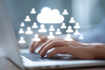 Close-up of hands typing on laptop, cloud of people icons above