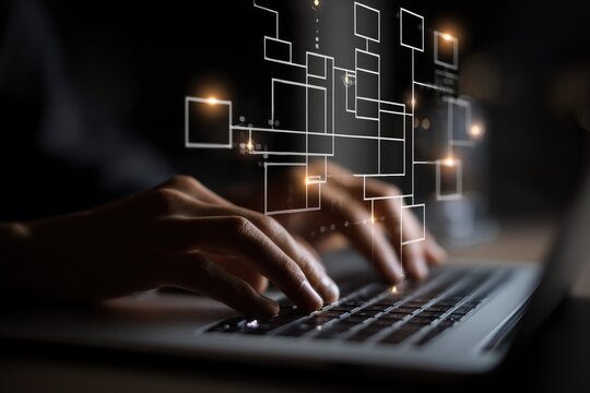 Close-up of hands typing on laptop, glowing digital flowchart in the background