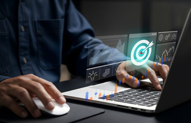 Strategic Data Analysis in Digital Business Workspace, Laptop shows charts, target icon, and innovation symbols in action