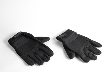 pair of jet black motorcycle gloves isolated on a white background