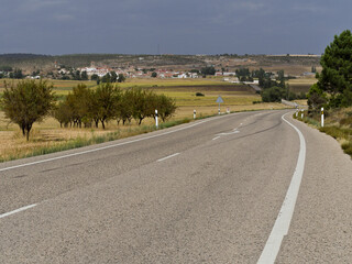 Road winds around an ancient village