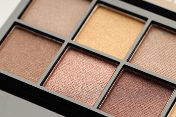 Beautiful eyeshadow palette as background, closeup. Cosmetic product