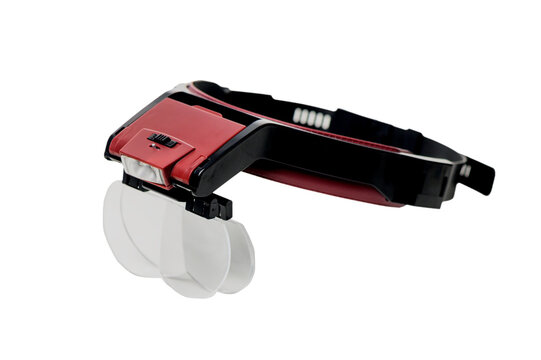 Head magnifier with light and 4 detachable lenses isolated on white background