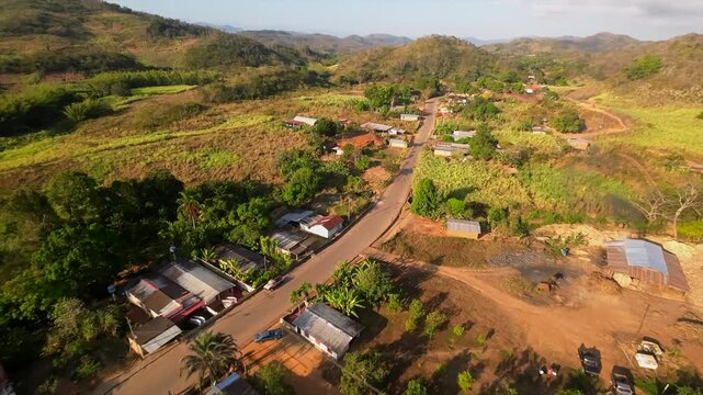 Drone view of Paradero town, nestled in mountains, roads and farms