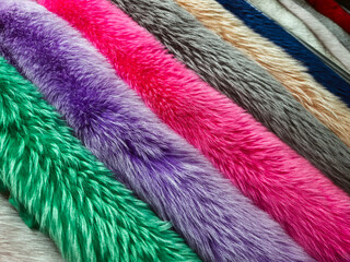 Colorful faux fur fabrics displayed in a textile shop for crafting and fashion design projects