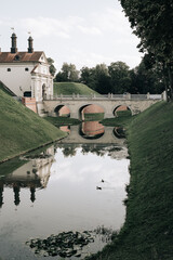 Naklejka premium Radziwill Castle, Belarus. Belarusian tourist landmark attraction Nesvizh Castle - medieval castle in autumn.