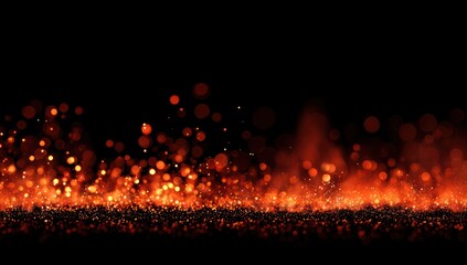 A vibrant display of warm orange and red sparks against a rich black backdrop, creating a dynamic and fiery effect.