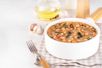 One pot Marry Me Butter Beans with white beans, Sun-Dried Tomatoes, spinach, garlic, hard cream and seasonings, fall season american comfort food, vegan healthy dinner rich in plant-based protein
