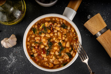 One pot Marry Me Butter Beans with white beans, Sun-Dried Tomatoes, spinach, garlic, hard cream and seasonings, fall season american comfort food, vegan healthy dinner rich in plant-based protein