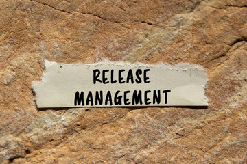 Release Management message written on ripped torn paper piece on stone background. Conceptual Release Management symbol. Copy space.