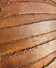Close up of rusty welded metal surface with textured seams