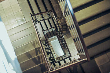 Overhead view of spiral staircase in Nizhny Novgorod, showcasing geometric patterns with soft light...