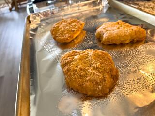 Frozen Chicken Patties on Foil Sheet for Baking