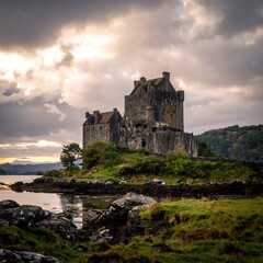 A dramatic, grey stone castle sits on a small island, partially shrouded in clouds