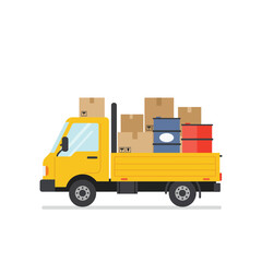 Fototapeta premium Yellow pickup truck loaded with boxes and barrels, side view.