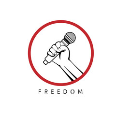 A person holds a microphone in his hand as a symbol of freedom of speech.