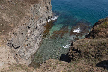 Dramatic Sea Cliffs and Clear Blue Ocean at Russky Island, Vladivostok, Russia