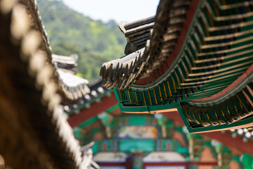 wooden eaves of the traditional Korean building in the Buddhist temple 