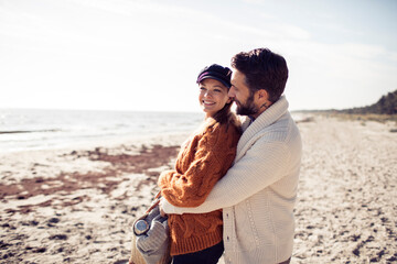 Couple embracing on the beach