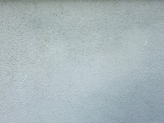 Gray concrete wall with rough textured surface background