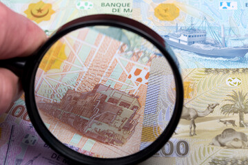 Mauritanian ouguiya in a magnifying glass