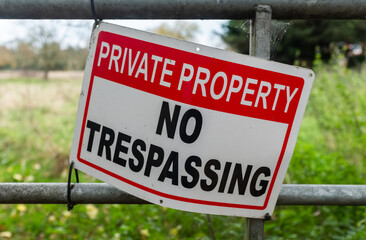 Private Property No Trespassing Sign on a Countryside Gate